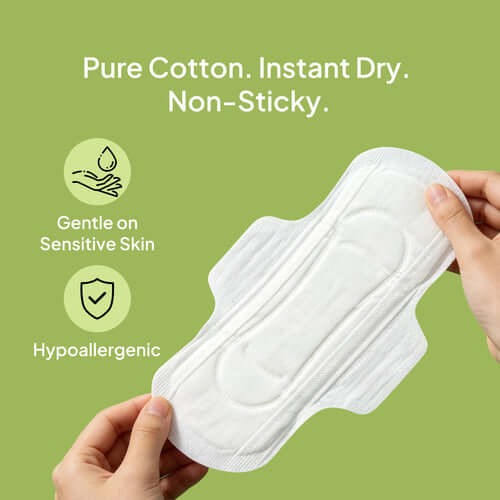Hypoallergenic pure cotton sanitary pad for sensitive skin on a green background